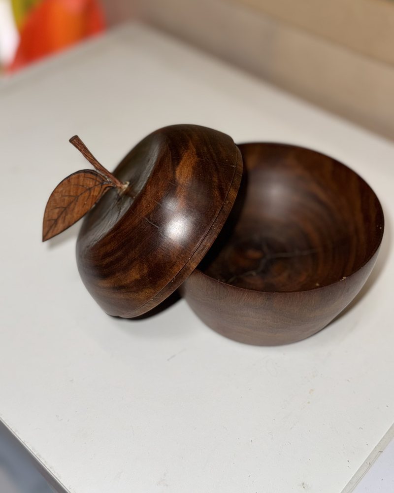 The turned apple opens into a small lidded bowl