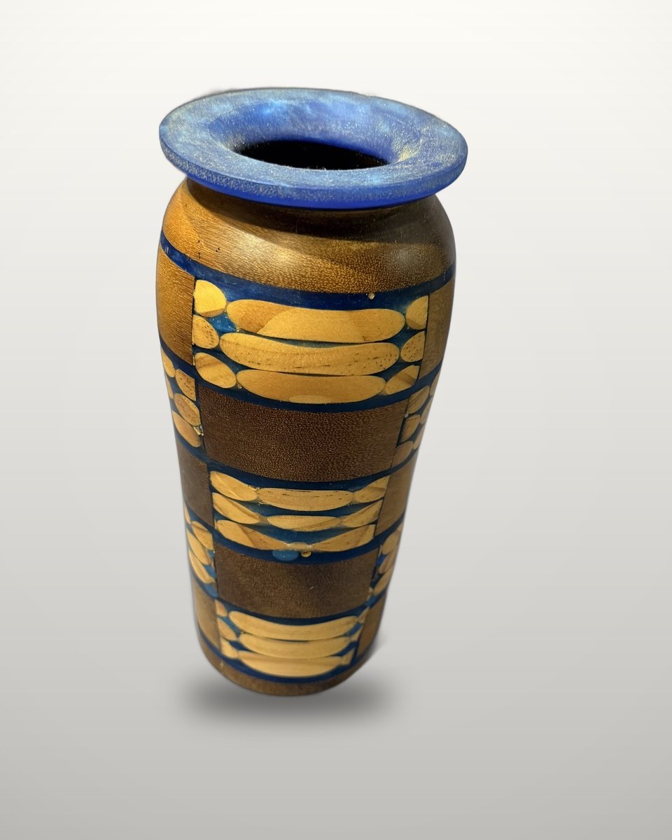 Tall vase in greenheart and maple with blue resin banding and a blue resin rim