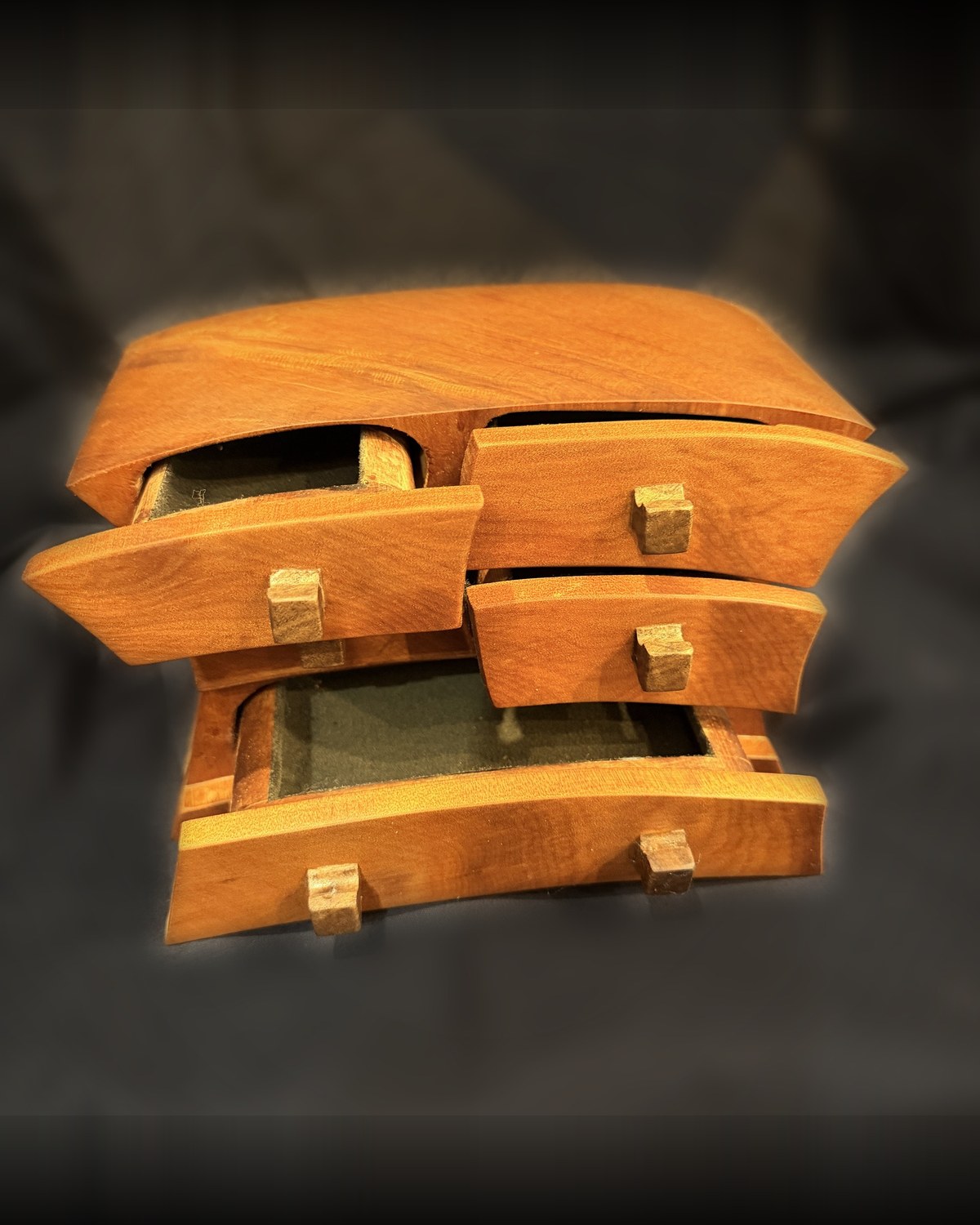 The kauri bandsaw box with its drawers pulled out, showing the felt-lined interiors