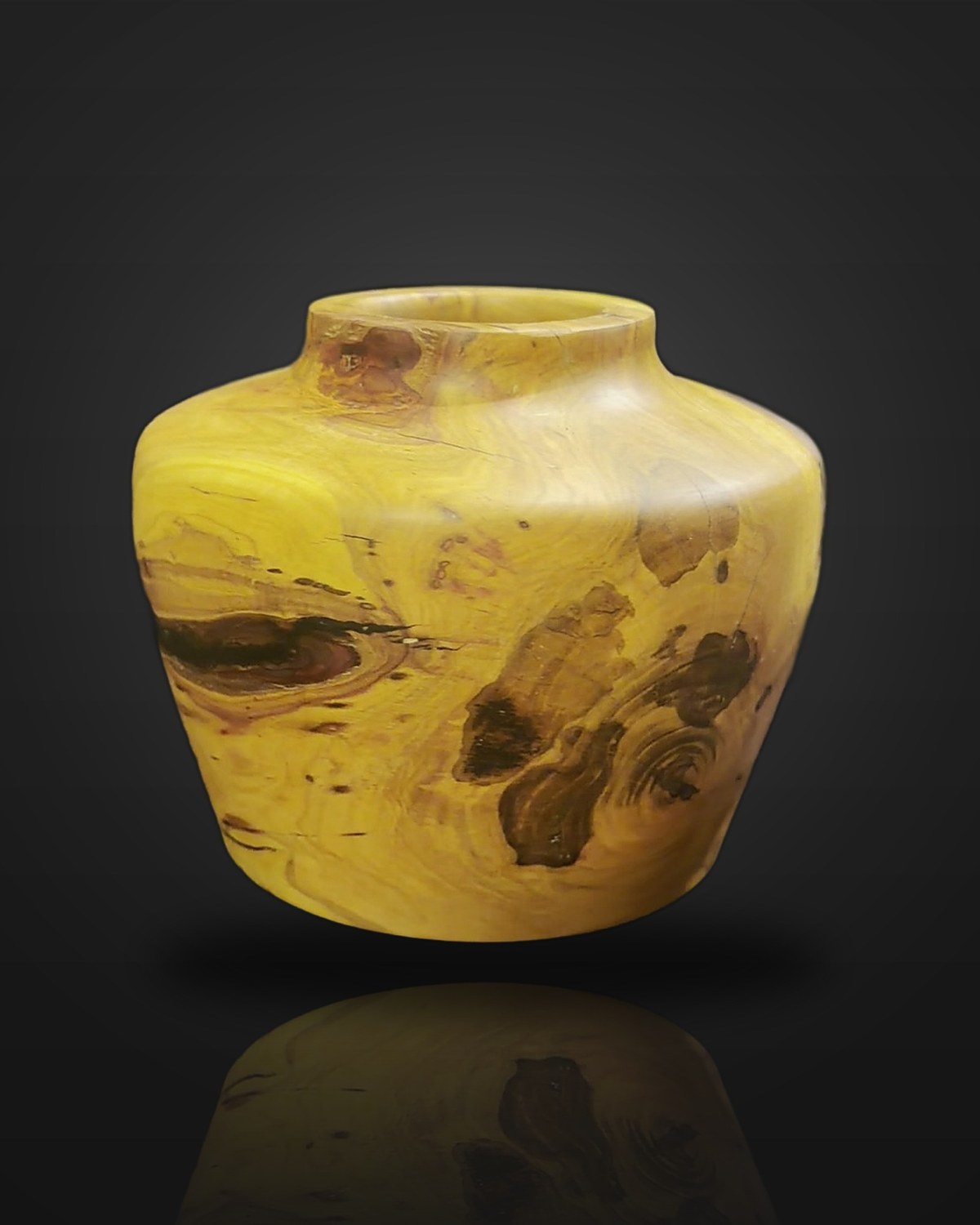 Plum and resin hollow form: rough-turned plum flooded with mica-tinted deep-pour resin to fill its voids and cracks, then finish-turned
