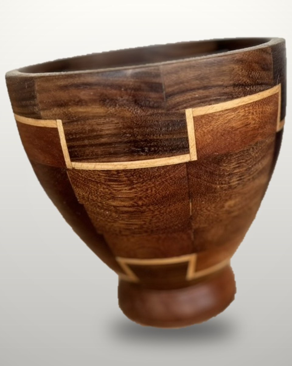 Segmented vessel in greenheart, maple and walnut on a turned pedestal foot, with stepped maple inlay