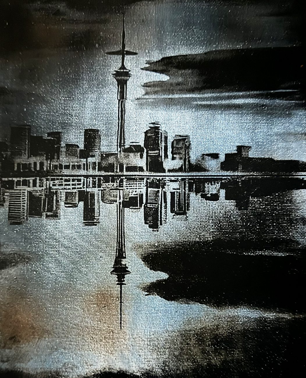 Auckland skyline and its reflection &mdash; Sky Tower and harbour, revealed in silver on black