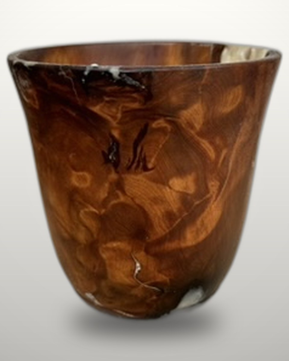 Swamp kauri vessel with resin, the figure shifting light across the grain